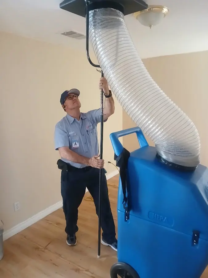 Furnace Tune-Up technician using HEPA equipment in Tuscaloosa